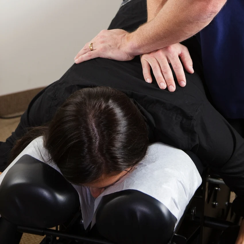 Illustrative chiropractic treatment on a therapy table